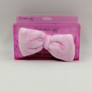 the Crème Shop teddy headband pink with smiley faces plush spa